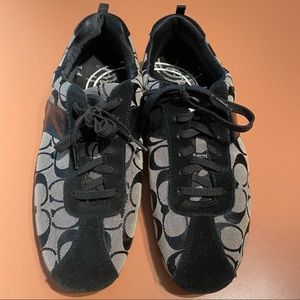 Coach sneakers size 10. Small area of worn tread on one of the shoes.